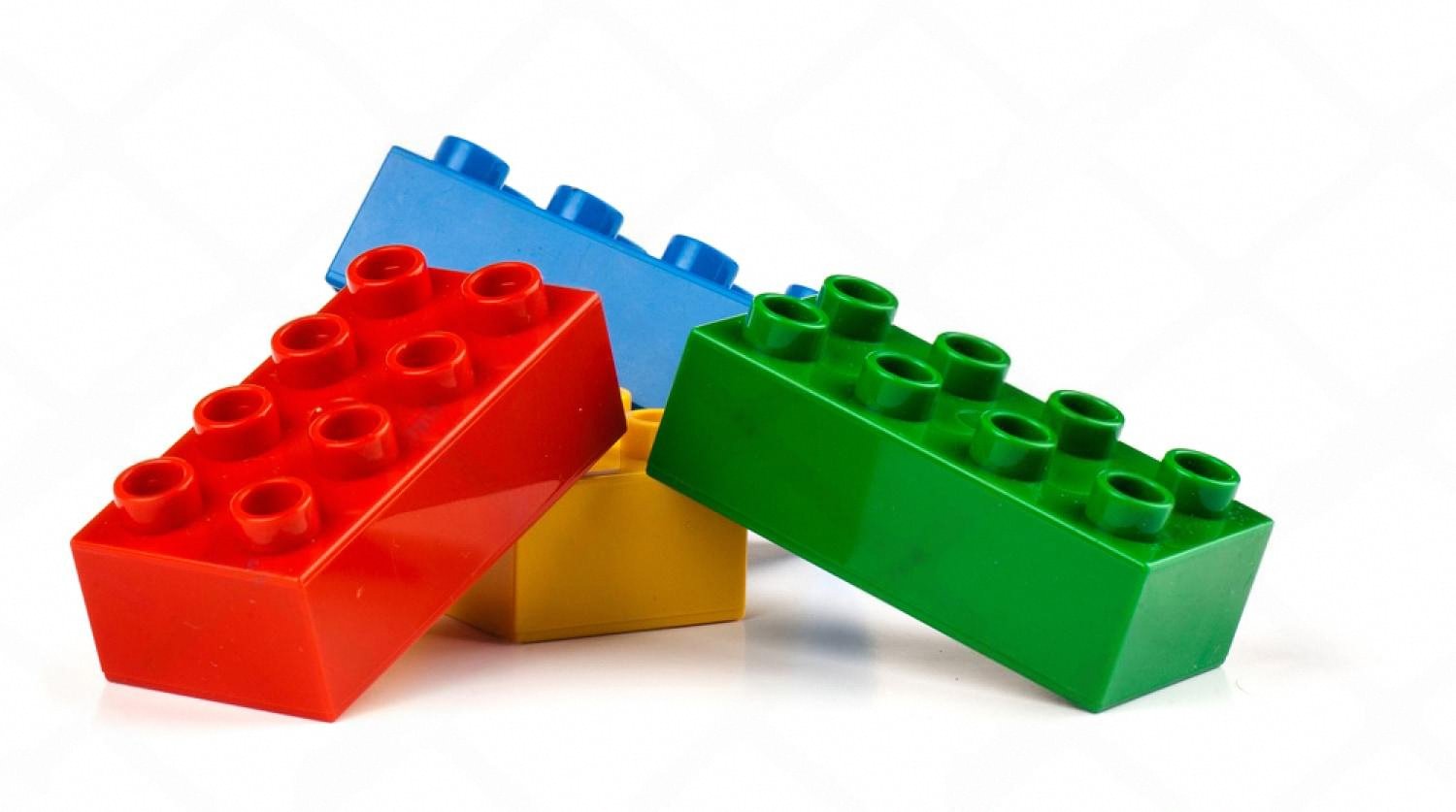 Close-up of red, blue, green and yellow plastic construction blocks